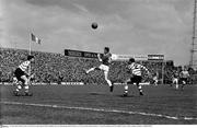 25 April 1965; Dick O'Connor, Limerick, in action against Paddy Mulligan, left, and John Keogh, Shamrock Rovers. FAI Cup Final, Shamrock Rovers v Limerick, Dalymount Park, Dublin. Picture credit; Connolly Collection / SPORTSFILE