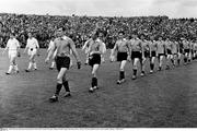 1965; The Down and Galway teams parade in front of Hill 16 ahead of the game. National Football League Semi-Final, Galway v Down, Croke Park, Dublin. Picture credit; Connolly Collection / SPORTSFILE