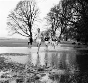 1966; Tom O'Riordan leads the field through water during the Amateur Athletic Union & N.A.C.A Championships, Gormanston, Dublin. Picture credit: Connolly Collection / SPORTSFILE