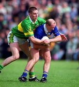 13 May 2001; Sean Collum of Tipperary is tackled by Darragh O'Se of Kerry during the Bank of Ireland Munster Senior Football Championship Quarter-Final match between Tipperary and Kerry at Ned Clonmel Sportsfield in Clonmel, Tipperary. Photo by Brendan Moran/Sportsfile