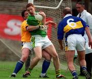 13 May 2001; Noel Kennelly of Kerry is tackled by Philly Ryan of Tipperary during the Bank of Ireland Munster Senior Football Championship Quarter-Final match between Tipperary and Kerry at Clonmel Sportsfield in Clonmel, Tipperary. Photo by Brendan Moran/Sportsfile