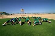 25 January 2001; Dubai Celts warm up prior to a training session at the Dubai Rugby Ground during the Eircell GAA All-Star Tour to Dubai, United Arab Emirates. Photo by Ray McManus/Sportsfile