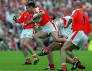 20 May 2001; Enda McNulty of Armagh is tackled by Owen Mulligan of Tyrone during the Bank of Ireland Ulster Senior Football Championship Quarter-Final match between Tyrone and Armagh at St Tiernach's Park in Clones, Monaghan. Photo by David Maher/Sportsfile