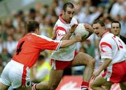 20 May 2001; Declan McCrossan of Tyrone in action against Justin McNulty of Armagh during the Bank of Ireland Ulster Senior Football Championship Quarter-Final match between Tyrone and Armagh at St Tiernach's Park in Clones, Monaghan. Photo by David Maher/Sportsfile