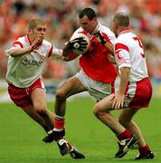 20 May 2001; Steven McDonnell of Armagh in action against Kevin Hughes and Chris Lawn of Tyrone during the Bank of Ireland Ulster Senior Football Championship Quarter-Final match between Tyrone and Armagh at St Tiernach's Park in Clones, Monaghan. Photo by Damien Eagers/Sportsfile