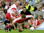 20 May 2001; Justin McNulty of Armagh in action against Owen Mulligan of Tyrone during the Bank of Ireland Ulster Senior Football Championship Quarter-Final match between Tyrone and Armagh at St Tiernach's Park in Clones, Monaghan. Photo by David Maher/Sportsfile