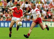 19 May 2001; Kieran McGeeney of Armagh in action against Sean Teague of Tyrone during the Bank of Ireland Ulster Senior Football Championship Quarter-Final match between Tyrone and Armagh at St Tiernach's Park in Clones, Monaghan. Photo by Damien Eagers/Sportsfile
