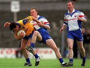 19 May 2001; Francie Grehan of Roscommon is tackled by Peter Loughran of New York during the Bank of Ireland All-Ireland Connacht Senior Football Championship Quarter-Final match between Roscommon and New York at Dr Hyde Park in Roscommon. Photo by Aoife Rice/Sportsfile