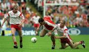 20 May 2001; John McEntee of Armagh in action against Kevin Hughes, right, and Sean Teague of Tyrone during the Bank of Ireland Ulster Senior Football Championship Quarter-Final match between Tyrone and Armagh at St Tiernach's Park in Clones, Monaghan. Photo by Damien Eagers/Sportsfile