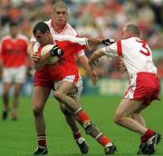 20 May 2001; Steven McDonnell of Armagh in action against Kevin Hughes, right, and Chris Lawn, 3, of Tyrone during the Bank of Ireland Ulster Senior Football Championship Quarter-Final match between Tyrone and Armagh at St Tiernach's Park in Clones, Monaghan. Photo by Damien Eagers/Sportsfile