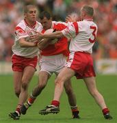 20 May 2001; Steven McDonnell of Armagh in action against Kevin Hughes and Chris Lawn, 3, of Tyrone during the Bank of Ireland Ulster Senior Football Championship Quarter-Final match between Tyrone and Armagh at St Tiernach's Park in Clones, Monaghan. Photo by Damien Eagers/Sportsfile