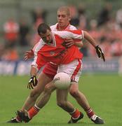 20 May 2001; Steven McDonnell of Armagh in action against Kevin Hughes of Tyrone during the Bank of Ireland Ulster Senior Football Championship Quarter-Final match between Tyrone and Armagh at St Tiernach's Park in Clones, Monaghan. Photo by Damien Eagers/Sportsfile