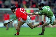 27 May 2001; William Deasy of Cork is tackled by Johnny Murphy of Limerick during the Guinness Munster Senior Hurling Championship Quarter-Final match between Cork and Limerick at Páirc Uí Chaoimh in Cork. Photo by Ray McManus/Sportsfile