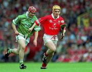 27 May 2001; Joe Deane of Cork is tackled by TJ Ryan of Limerick during the Guinness Munster Senior Hurling Championship Quarter-Final match between Cork and Limerick at Páirc Uí Chaoimh in Cork. Photo by Ray McManus/Sportsfile