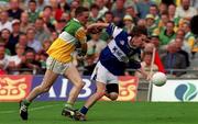27 May 2001; Colm Parkinson of Laois is tackled by Ger Rafferty of Offaly during the Bank of Ireland Leinster Senior Football Championship Quarter-Final match between Offaly and Laois at Croke Park in Dublin. Photo by Damien Eagers/Sportsfile