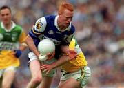 27 May 2001; Padraig Clancy of Laois is tackled by Barry Malone of Offaly during the Bank of Ireland Leinster Senior Football Championship Quarter-Final match between Offaly and Laois at Croke Park in Dublin. Photo by Damien Eagers/Sportsfile