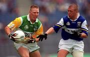 27 May 2001; Neville Coughlan of Offaly is tackled by David Brennan of Laois during the Bank of Ireland Leinster Senior Football Championship Quarter-Final match between Offaly and Laois at Croke Park in Dublin. Photo by Brendan Moran/Sportsfile