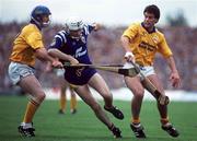 4 July 1993; Ger O'Loughlin of Clare, in action against Paul Delaney, left, and Raymie Ryan of Tipperary during the Munster Senior Hurling Championship Final match between Clare and Tipperary at the Gaelic Grounds in Limerick. Photo by Ray McManus/Sportsfile