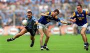 27 May 2001; Ciaran Whelan of Dublin is tackled by David Hannify of Longford during the Bank of Ireland Leinster Senior Football Championship Quarter-Final match between Dublin and Longford at Croke Park in Dublin. Photo by Damien Eagers/Sportsfile
