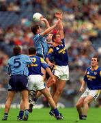 27 May 2001; Enda Sheehy and team-mate Ciaran Whelan of Dublin go up for the ball against Ian Browne of Longford during the Bank of Ireland Leinster Senior Football Championship Quarter-Final match between Dublin and Longford at Croke Park in Dublin. Photo by Brendan Moran/Sportsfile