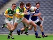 27 May 2001; Chris Conway of Laois is tackled by Cahill Daly of Offaly during the Bank of Ireland Leinster Senior Football Championship Quarter-Final match between Offaly and Laois at Croke Park in Dublin. Photo by Brendan Moran/Sportsfile