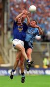 27 May 2001; Darren Homan of Dublin is tackled by David Hannify of Longford during the Bank of Ireland Leinster Senior Football Championship Quarter-Final match between Dublin and Longford at Croke Park in Dublin. Photo by Damien Eagers/Sportsfile