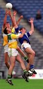 27 May 2001; Ciaran McManus and Sean Grennan of Offaly in action against Noel Garvan of Laois during the Bank of Ireland Leinster Senior Football Championship Quarter-Final match between Offaly and Laois at Croke Park in Dublin. Photo by Brendan Moran/Sportsfile