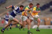 27 May 2001; Neville Coughlan of Offaly races clear of Noel Garvan of Laois during the Bank of Ireland Leinster Senior Football Championship Quarter-Final match between Offaly and Laois at Croke Park in Dublin. Photo by Brendan Moran/Sportsfile