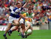 27 May 2001; Neville Coughlan of Offaly is challenged by John Kealy of Laois during the Bank of Ireland Leinster Senior Football Championship Quarter-Final match between Offaly and Laois at Croke Park in Dublin. Photo by Damien Eagers/Sportsfile