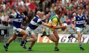 27 May 2001; Ciaran McManus of Offaly is tackled by Pauraic Leonard, 7, and David Brennan of Laois during the Bank of Ireland Leinster Senior Football Championship Quarter-Final match between Offaly and Laois at Croke Park in Dublin. Photo by Brendan Moran/Sportsfile