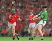 27 May 2001; James Moran of Limerick clears under pressure from Jerry O'Connor of Cork during the Guinness Munster Senior Hurling Championship Quarter-Final match between Cork and Limerick at Páirc Uí Chaoimh in Cork. Photo by Ray McManus/Sportsfile