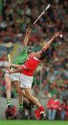 27 May 2001; Ciaran Carey of Limerick contests a high ball with Alan Browne of Cork during the Guinness Munster Senior Hurling Championship Quarter-Final match between Cork and Limerick at Páirc Uí Chaoimh in Cork. Photo by Ray McManus/Sportsfile