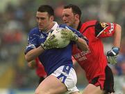 27 May 2001; Peter Reilly of Cavan in action against Simon Poland of Down during the Bank of Ireland Ulster Senior Football Championship Quarter-Final match between Down and Cavan at Casement Park in Belfast. Photo by David Maher/Sportsfile