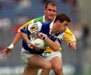 27 May 2001; Damien Ryan of Laois in action against Mel Keeneghan of Offaly during the Bank of Ireland Leinster Senior Football Championship Quarter-Final match between Offaly and Laois at Croke Park in Dublin. Photo by Brendan Moran/Sportsfile