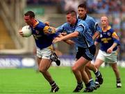 27 May 2001; Trevor Smullen of Longford is tackled by Darren Homan of Dublin during the Bank of Ireland Leinster Senior Football Championship Quarter-Final match between Dublin and Longford at Croke Park in Dublin. Photo by Damien Eagers/Sportsfile
