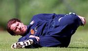 28 May 2001; Kenny Cunningham who did not take part during a Republic of Ireland squad training session gets through some stretching at AUL grounds in Clonshaugh, Dublin. Photo by David Maher/Sportsfile