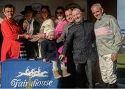 29 March 2016; Jockey Ruby Walsh, right, with winning connections including Clodagh Casey, age 2, daughter of retired jockey David Casey, second from right, who is now an assistant to trainer Willie Mullins, after winning the Farmhouse Foods Handicap Hurdle on Clondaw Warrior. Horse Racing - Fairyhouse Easter Festival. Fairyhouse, Co. Meath. Picture credit: Cody Glenn / SPORTSFILE