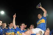 31 March 2010; Tipperary captain Ciaran McDonald celebrates with the trophy following his side’s victory over Kerry. Cadbury Munster GAA Football Under 21 Championship Final, Kerry v Tipperary, Austin Stack Park, Tralee, Co. Kerry. Picture credit: Stephen McCarthy / SPORTSFILE