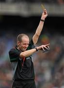 17 March 2010; Referee Cathal McAllister issues a yellow card to a player during the game. AIB GAA Hurling All-Ireland Senior Club Championship Final, Ballyhale Shamrocks v Portumna, Croke Park, Dublin. Picture credit: Brendan Moran / SPORTSFILE