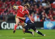 2 April 2010; Jerry Flannery, Munster, is tackled by Isa Nacewa, Leinster. Celtic League, Munster v Leinster, Thomond Park, Limerick. Picture credit: Stephen McCarthy / SPORTSFILE