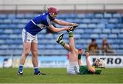 2 April 2016; Shane Nolan, Kerry, gets some assistance from Ryan Mullaney, Laois, after going down with cramp during the game. Allianz Hurling League Division 1B Relegation Play-off, Kerry v Laois. Austin Stack Park, Tralee, Co. Kerry.  Picture credit: Diarmuid Greene / SPORTSFILE