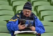 2 April 2016; A  Leinster supporters reads his match programme ahead of the Guinness PRO12 round 19 clash between Leinster and Munster at the Aviva Stadium, Lansdown Road, Dublin Picture credit: Brendan Moran / SPORTSFILE