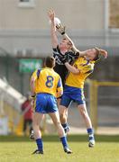 3 April 2010; Cathal Burns, Sligo, in action against Niall Carty, left, and Kevin Higgins, Roscommon. Cadbury Connacht GAA Football Under 21 Football Championship Final, Sligo v Roscommon, Markievicz Park, Sligo. Picture credit: Pat Murphy / SPORTSFILE