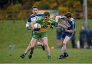 3 April 2016; Leo McLoone, Donegal, in action against Fintan Kelly, left, and Karl O'Connell, Monaghan. Allianz Football League Division 1, Round 7, Monaghan v Donegal. St Mary's Park, Castleblayney, Co. Monaghan. Picture credit: Dáire Brennan / SPORTSFILE