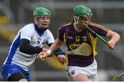 3 April 2016; Conor McDonald, Wexford, is tackled by Tom Devine, Waterford. Allianz Hurling League Division 1 Quarter-Final, Wexford v Waterford.Innovate Wexford Park, Wexford. Picture credit: Ramsey Cardy / SPORTSFILE