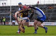 3 April 2016; Paudie Foley, Wexford, is tackled by Tom Devine, Waterford. Allianz Hurling League Division 1 Quarter-Final, Wexford v Waterford.Innovate Wexford Park, Wexford. Picture credit: Ramsey Cardy / SPORTSFILE