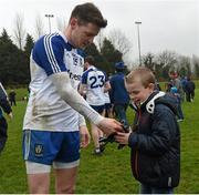 3 April 2016; Conor McManus Monaghan giving 8 year old, Mark McCaffrey from Scotstown Co.Monaghan his gloves after the game. Allianz Football League Division 1, Round 7, Monaghan v Donegal. St Mary's Park, Castleblayney, Co. Monaghan.  Picture credit: Philip Fitzpatrick / SPORTSFILE