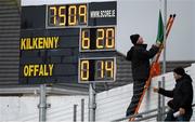 3 April 2016; With the scoreboard to his left Kilkenny groundsman Timmy Grogan lowers the Tricolour, which had flown at half mast in honour of the late Jim McGrath, after the game. Allianz Hurling League Division 1 Quarter-Final, Kilkenny v Offaly. Nowlan Park, Kilkenny. Picture credit: Ray McManus / SPORTSFILE