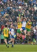 3 April 2016; Karl O'Connell, Monaghan, competes for a high ball against Michael Murphy, left, and Rory Kavanagh, Donegal. Allianz Football League Division 1, Round 7, Monaghan v Donegal. St Mary's Park, Castleblayney, Co. Monaghan. Picture credit: Dáire Brennan / SPORTSFILE