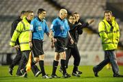 6 April 2010; Bohemians manager Pat Fenlon with referee Dave McKeon as the teams leave the pitch for half-time. Airtricity League, Premier Division, Bohemians v St. Patrick’s Athletic, Dalymount Park, Dublin. Picture credit: David Maher / SPORTSFILE
